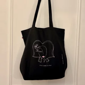 Sac shopping pratique, fond noir, imprimé alsacienne rose avec fleur dans les cheveux